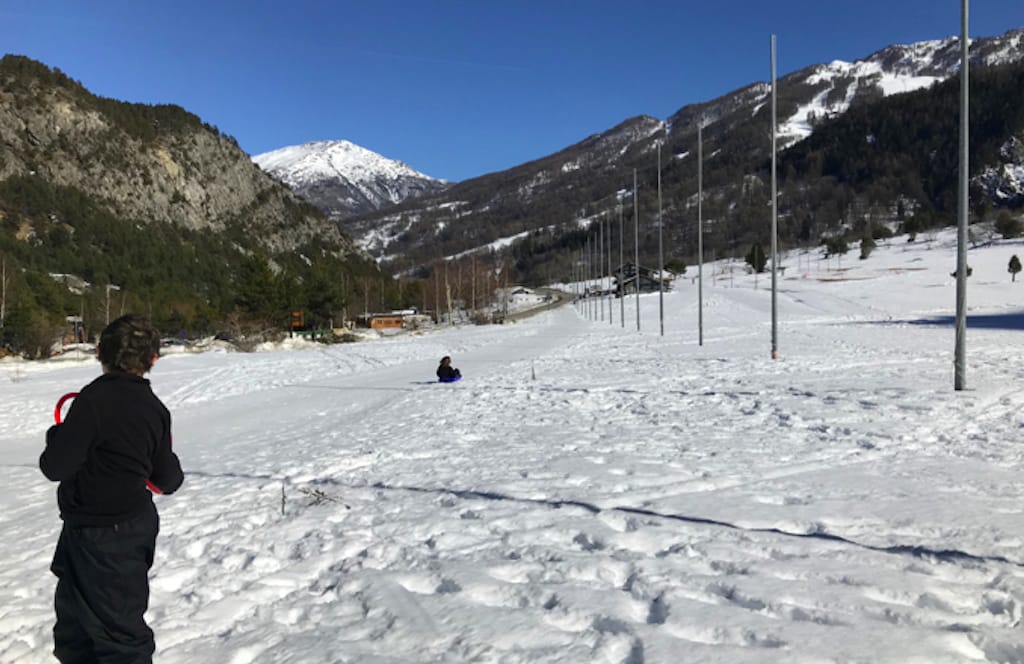 image shows Davide sledging in the snow