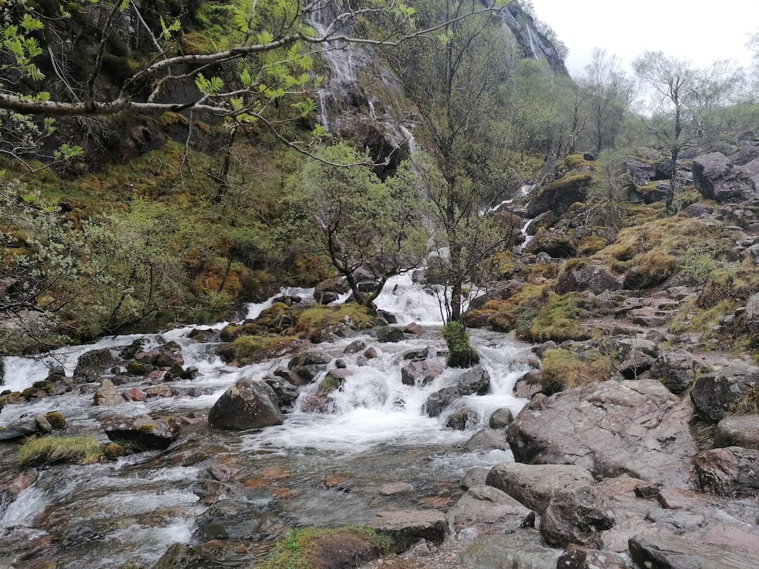 a river rushes over some rocks in the Lost Valley Walk