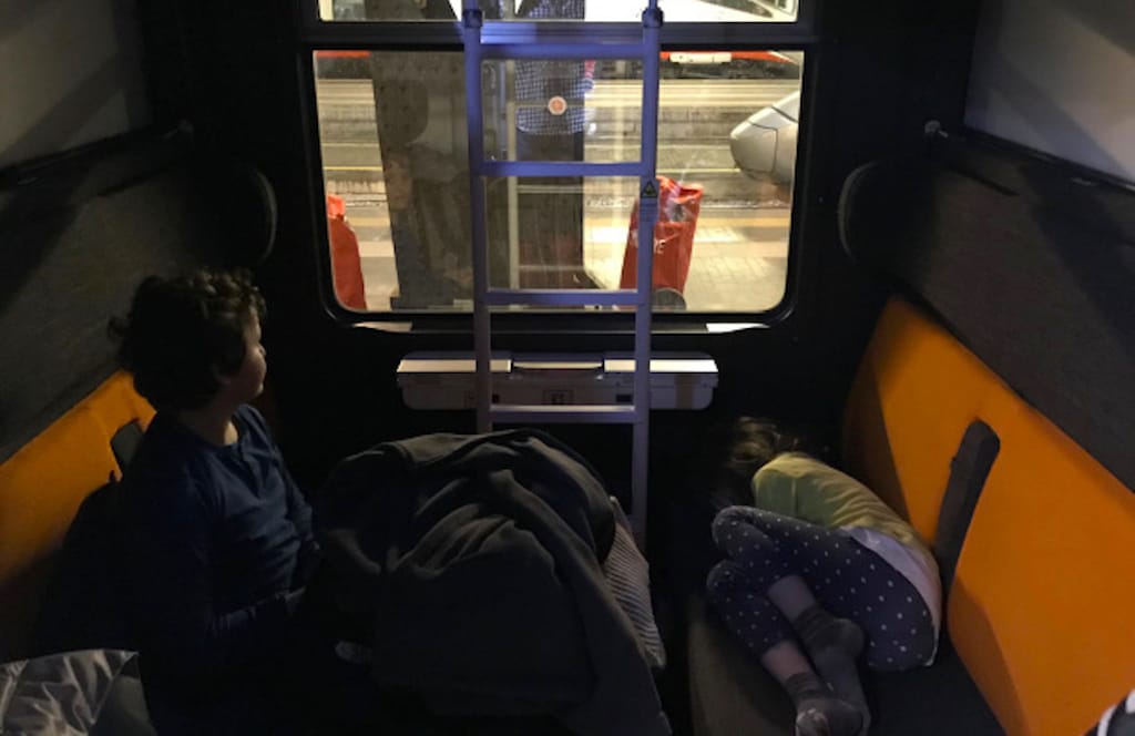 Davide and his sister on the sleeper train