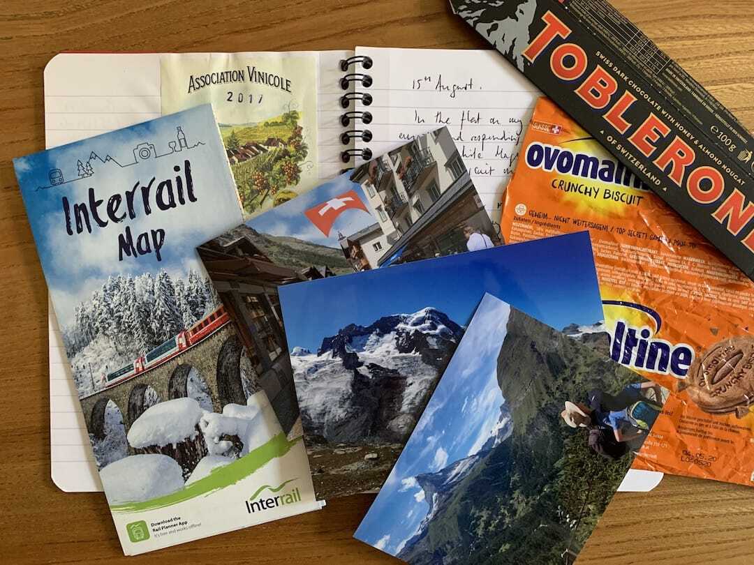 A holiday journal with a day-by-day account and tickets, maps, photos and Swiss confectionary wrappers.